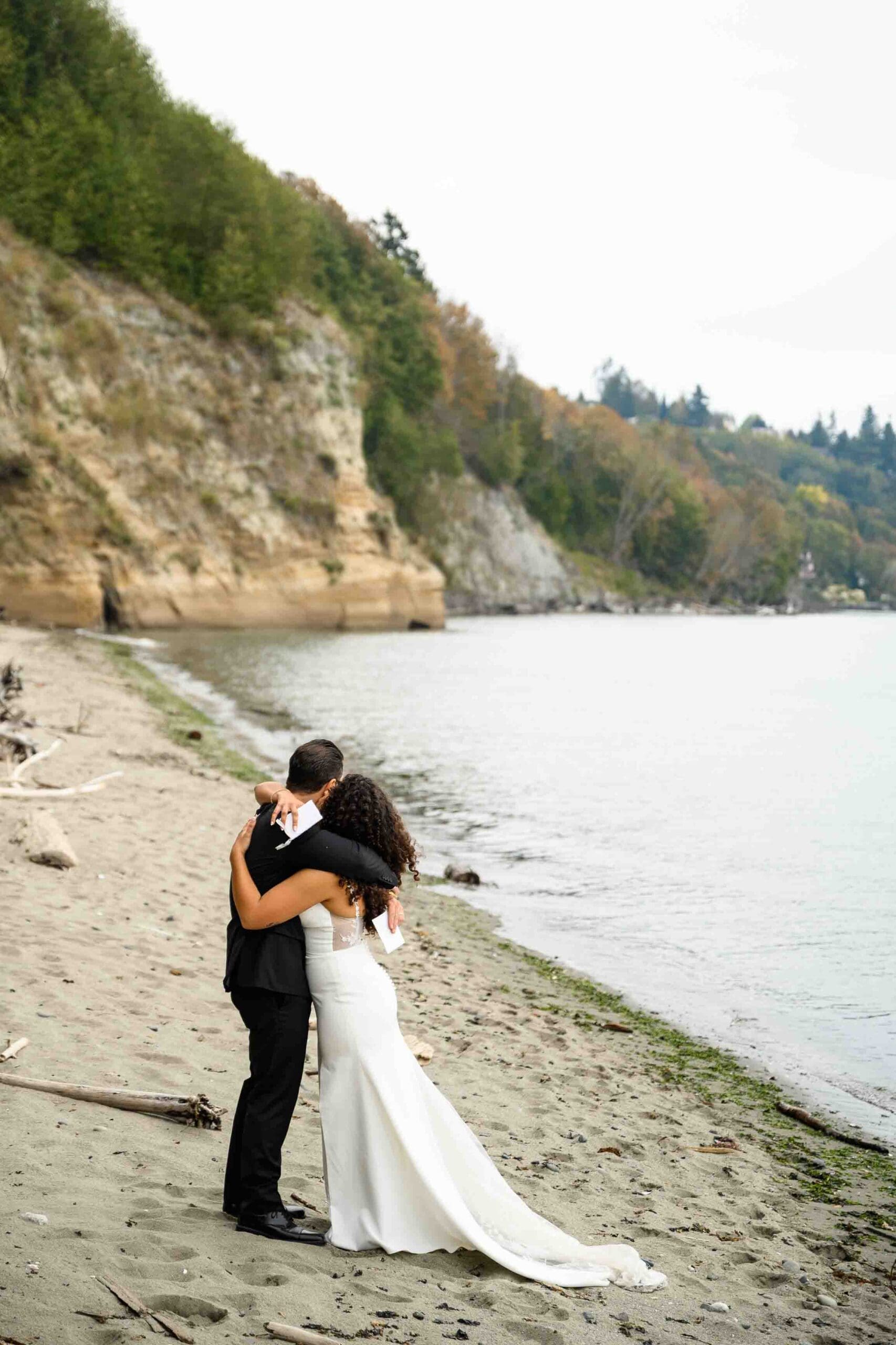 Seattle elopement photos of Sasha and William exchanging vows at Discovery Park beach, with portraits at the University of Washington and a rooftop ceremony at the Seattle Municipal Courthouse.