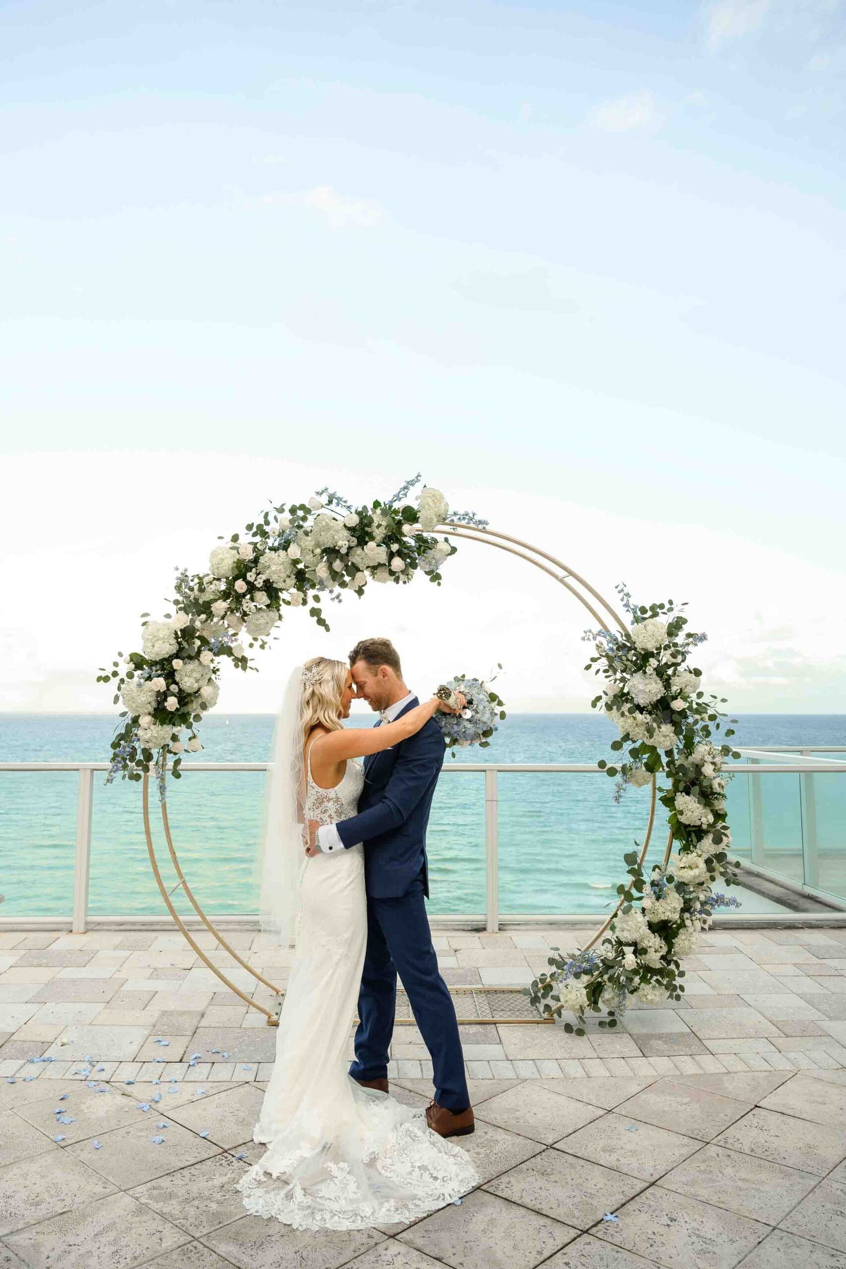 Megan and Kyle during their wedding at Margaritaville Resort Hollywood Beach in Florida with coastal resort views